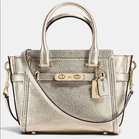 Coach Handbags - Coach Swagger 21 Platinum Metallic Leather Purse